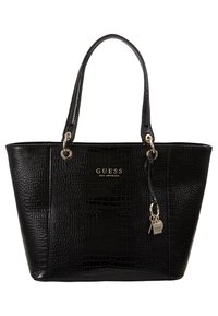 Sac cabas en simili cuir noir avec une texture crocodile, une quincaillerie argentée, deux poignées et un porte-bonheur décoratif. Logo sur le devant.