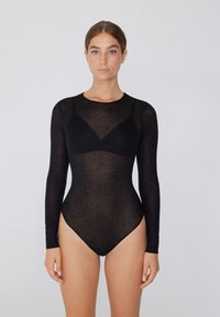 Schwarzer Langarm-Bodysuit aus transparenter Stoff, der ein enges Design mit einem Rundhalsausschnitt und einer tief ausgeschnittenen Bralett-Detail aufweist.