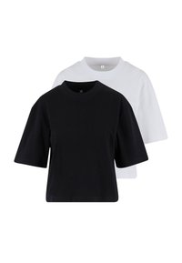 Deux t-shirts unis à col rond en petite taille, un noir devant et un blanc derrière, sur fond blanc.