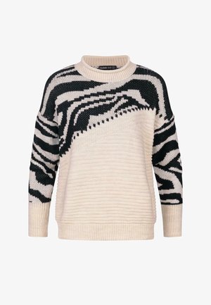 Suéter color crema con un diseño de punto texturizado, que presenta rayas de cebra en blanco y negro en los hombros y las mangas.