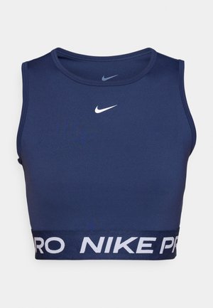Marineblaues Sport-Crop-Top aus dehnbarem Material, mit einem runden Ausschnitt und weißem "NIKE PRO"-Logo auf einem elastischen Bund.