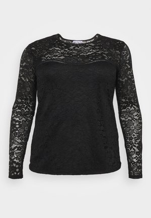 Haut en dentelle noir à manches longues avec motif floral, dentelle transparente sur les manches et le haut de la poitrine, tissu uni sur le corps, col rond.