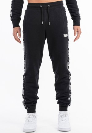 JOGGING SCHMALE PASSFORM TENSTON - Jogginghose - black white