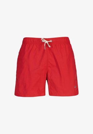 Shorts de bain rouges avec taille élastique et cordon blanc, arborant un petit logo sur la partie inférieure de la jambe droite.