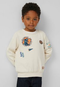 Cremefarbener Sweatshirt mit grafischen Drucken, darunter ein Dinosaurier, Text und Fahnen. Gerippte Bündchen und Saum, weicher Stoff, runder Halsausschnitt.