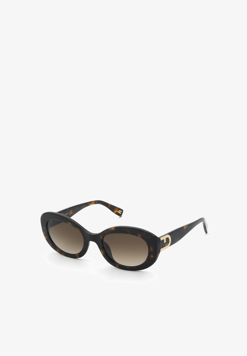 Lunettes de soleil ovales en écaille de tortue avec des verres dégradés foncés et des accents métalliques dorés près des charnières.
