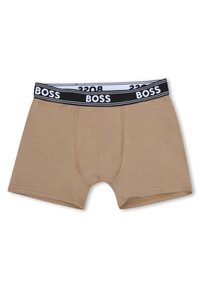 Μπεζ μποξέρ σορτς από απαλό ύφασμα με μαύρη ελαστική ζώνη μέσης με λευκά γράμματα. Κλειστό μπροστινό μέρος με λείο υφή.