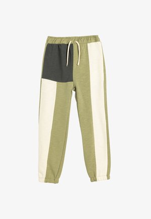 Groene en beige gestreepte joggingbroeken met een elastische tailleband en trekkoord. Voorzien van een kleurblokontwerp met contrasterende stoftexturen.