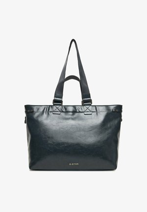 Bolso tote de cuero negro con dos asas y logo G-STAR centrado cerca de la parte inferior, mostrado sobre un fondo blanco.