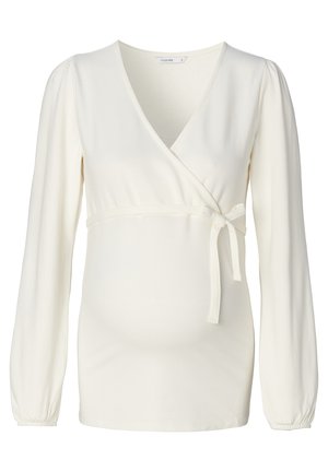 Crème-kleurige wikkeltop van zachte stof. Heeft lange pofmouwen, een strik in de taille en een diepe V-halslijn voor een getailleerde look.