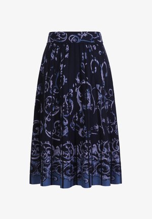 Navy pleated skirt featuring a floral swirl pattern in lighter shades of blue. Gradual color transition from dark to light at the hem.