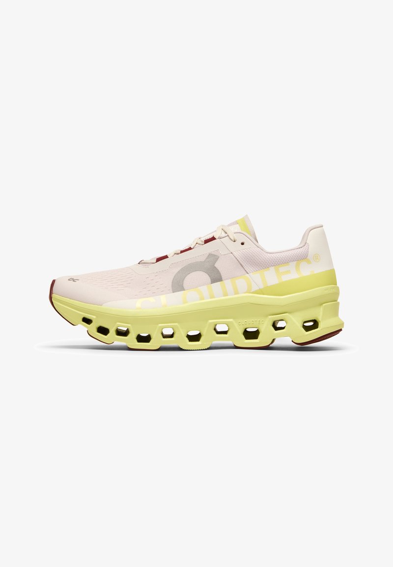 Light pink mesh running shoe with a thick yellow sole, hexagonal cutouts, and gray branding. Features white laces and red accents.