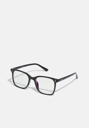 Lunettes rectangulaires noires avec des verres transparents, présentant des accents en or sur la monture et une légère teinte violette sur un des verres.