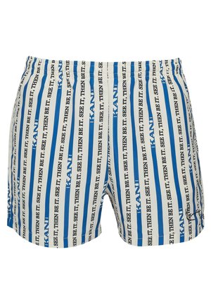 Ujumispüksid, millel on vertikaalsed sinised ja valged triibud ning mustad tekstimustrid. Elastsest vööst mugavuse tagamiseks, kerge materjal.