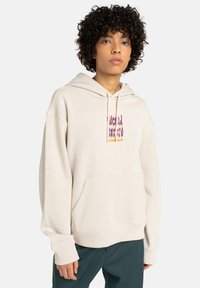 Beige hoodie van zachte stof met een kangoeroezak, trekkoordcapuchon en kleurrijke grafische print op de borst. Relaxte pasvorm, geribde manchetten.