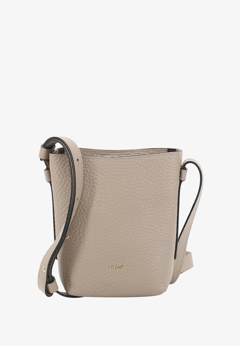 Beige leather bucket bag with a textured surface, adjustable strap, gold logo detail, and open top design. Designed for casual use.
