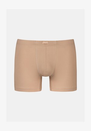 Beige cotton boxer shorts with a fitted design, featuring a soft elastic waistband and subtle stitching details.