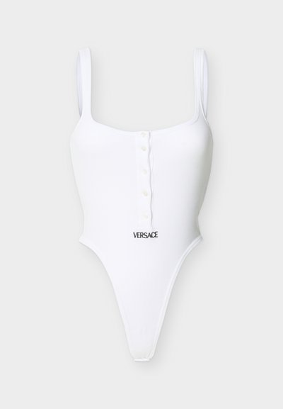 Valge varrukateta soonikkoes bodi esiküljel nuppudega ja musta "Versace" logoga tikand vöökohal.