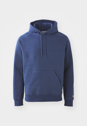 Tumed sinine kapuutsiga sviiter, mis on valmistatud pehmest kangast, esiküljel on kenguru tasku, ribatud mansetid ja reguleeritav kapuuts.