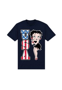 Námořnická modrá bavlněná tričko s kreslenou postavičkou v černých šatech, s červenými podpatky, a nápisem "USA" v červené a bílé barvě se modrými hvězdami.