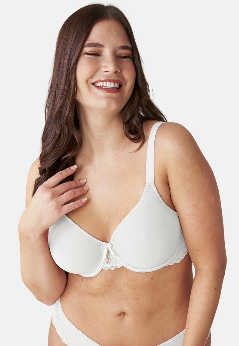 White bra with molded cups, lace accents along the bottom, adjustable straps, and a small decorative center clip. Smooth texture.