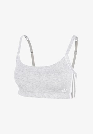 Světle šedá sportovní podprsenka s nastavitelnými ramínky a bílými třemi pruhy Adidas a logem na boku.
