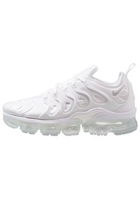 White athletic shoe featuring a textured upper, distinctive wave-like design, and a transparent air-cushioned sole.