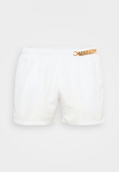 White swim shorts made of smooth fabric, featuring an elastic waistband and a gold-tone "Moschino" logo accent on the front.