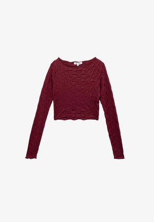 Top corto a maniche lunghe in bordeaux, con una trama testurizzata di forme a diamante in rilievo e orlo ondulato. Tessuto elasticizzato.