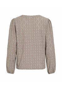 Šviesiai ruda palaidinė su tekstūruotu deimanto raštu, pūstomis rankovėmis ir apvalia iškirpte. Audinys šiek tiek permatomas ir bitutėtas.