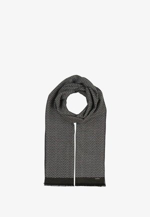 Écharpe en motif chevron noir et gris, fabriquée en tissu texturé avec des bords frangés et une étiquette à une extrémité.