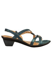 Sandale pour femme à petit talon métallique bleu avec trois brides, une décoration en forme de fleur sur la bride avant, et une semelle intérieure rembourrée de couleur beige.
