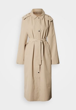 Beige trenchcoat med belte i midjen, lange ermer, skulderklaffer og knappestolpe foran. Glatt stoff med to sidelommer.