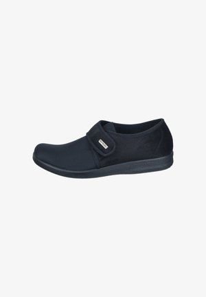 Black slip-on shoe with a smooth fabric upper and suede accents. Features a Velcro strap for easy adjustment and a textured rubber sole.