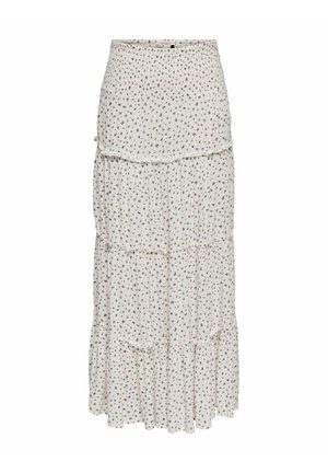 Jupe longue blanche à volants avec un petit imprimé floral noir et des coutures froncées, dotée d'une taille haute et d'un tissu fluide.