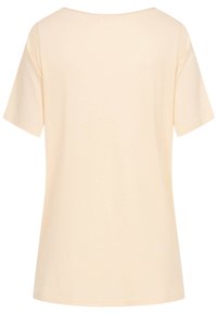 Krátký rukáv, krémové tričko vyrobené z měkké bavlny. Má volný střih, široký výstřih a hladkou texturu.