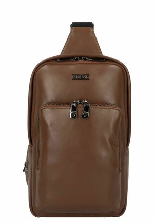 Brown leather backpack with a zippered main compartment and front pocket, featuring silver hardware and a branded logo panel.