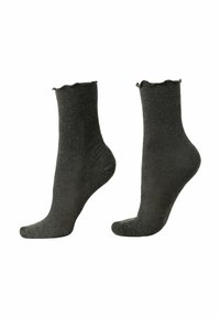 Chaussettes noires côtelées à la cheville avec un bord festonné. Fabriquées en matériau doux et texturé, offrant un ajustement confortable et un design décontracté.