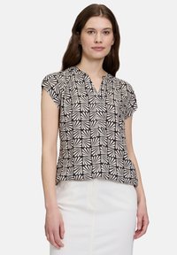 Zwart en crèmekleurig blouse met korte mouwen, voorzien van een geometrisch bladenpatroon, v-hals en een ontspannen pasvorm. Soepele stoftextuur.