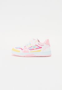 White sneaker with pink accents, featuring colorful doodle-style designs, a hook-and-loop strap, and a textured rubber sole.