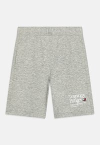 Šedé bavlněné šortky s elastickým pasem, bočními kapsami a bílým potiskem loga Tommy Hilfiger na dolním levém předním dílu.