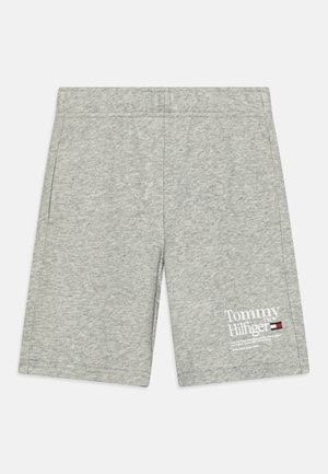 Shorts en coton gris avec une taille élastique, des poches latérales et un imprimé logo blanc de Tommy Hilfiger en bas à gauche à l'avant.
