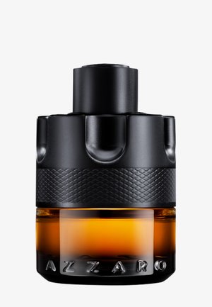 Svart parfymeflaske formet som en granat med ravfarget væske inni og «AZZARO» preget på nederste front.
