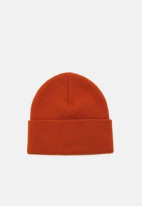 Beanie lavorato a maglia di un vivace colore arancione, con un risvolto e un tessuto strutturato, dal design con la parte superiore arrotondata.