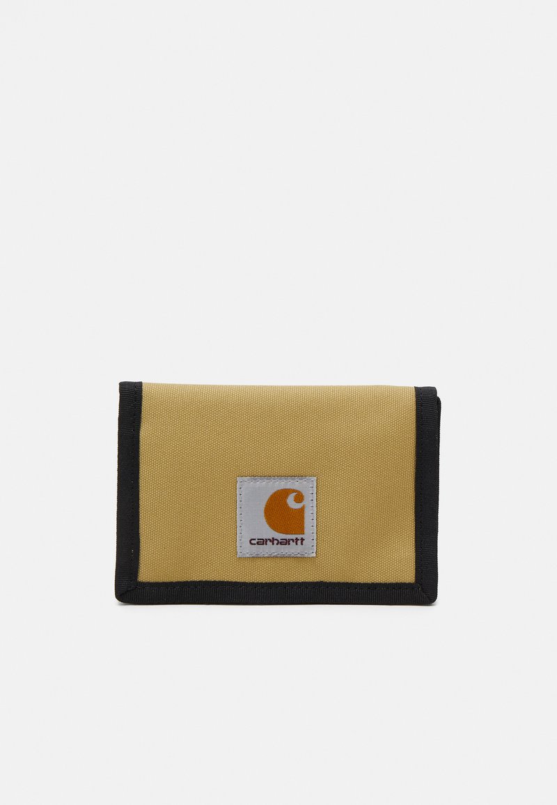 Yellow fabric wallet with black trim, featuring a visible white square label with an orange logo. Compact, rectangular design.