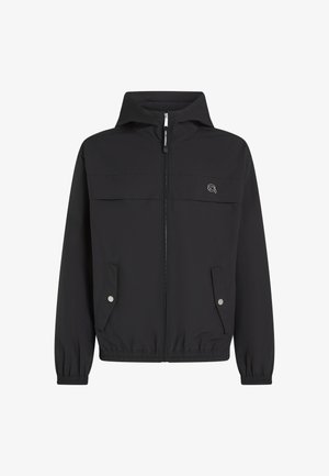 Must mustaga, millel on tõmblukk, kaks esi-taskut, elastsed varrukad ja lihtne logo vasakul rinnal. Sile, kerge kangas.