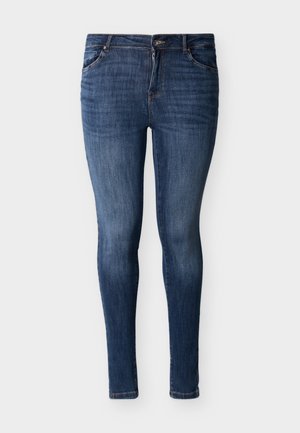 Úzké džíny z tmavě modrého denimu s vybledlou texturou. Mají tradiční pás s knoflíkem a zapínáním na zip vpředu.