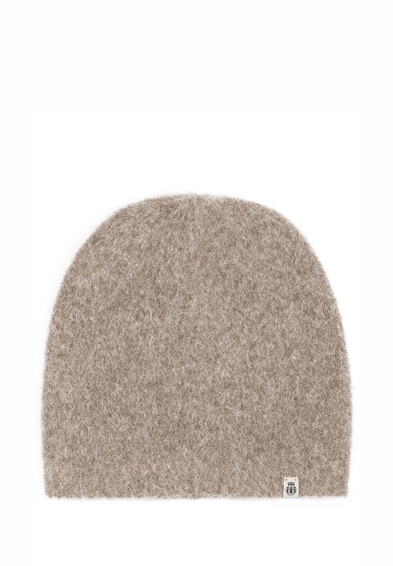 Beige knit beanie made from soft wool, featuring a rounded top and a small logo tag on the bottom right. Fuzzy texture with no visible patterns.