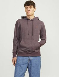 Maroon hoodie with a front kangaroo pocket, drawstring hood, and ribbed cuffs. Worn with light blue denim jeans.