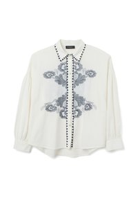 White blouse with dark blue floral embroidery, contrasting button placket, and pointed collar. Features gathered sleeves and a relaxed fit.